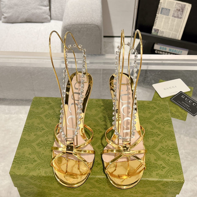STRAPPY SANDAL WITH RHINESTONE CHAIN IN GOLD PATENT LEATHER