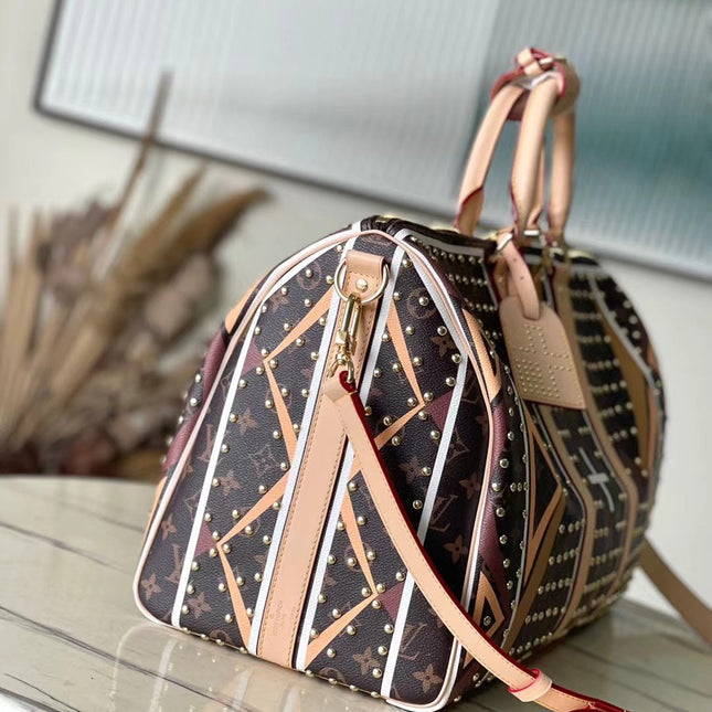KEEPALL BANDOULIÈRE 50 IN PARFLECHE PATTERN MONOGRAM CANVAS