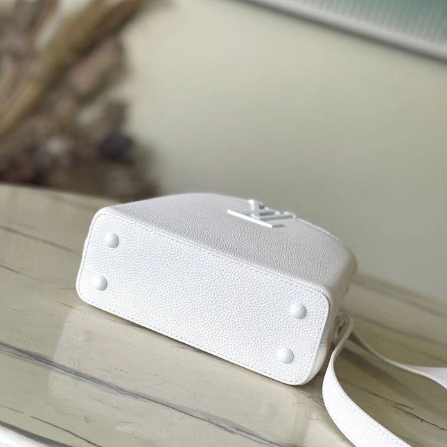 CAPUCINES EAST-WEST MINI 21 IN WHITE TAURILLON