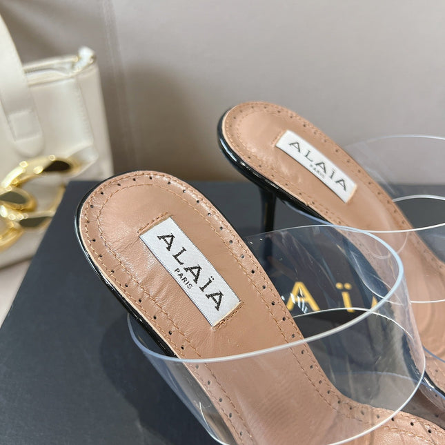 ALAIA HIGH MULES IN BLACK PATENT CALFSKIN AND FILM