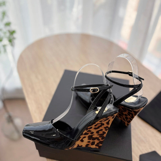 LA SCANDALE HIGH 10 CM WEDGE SANDALS IN BLACK PATENT LEATHER