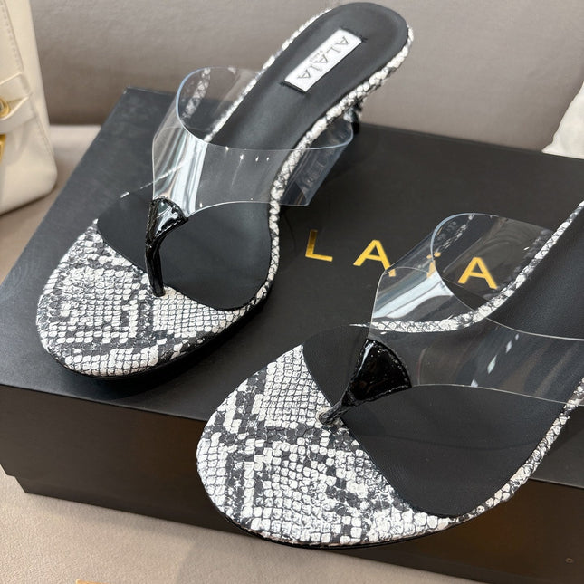 ALAIA HEELED THONG 25S 55 MM IN WHITE AND BLACK LAMBSKIN SNAKE-EMBOSSED WITH CLEAR STRAP
