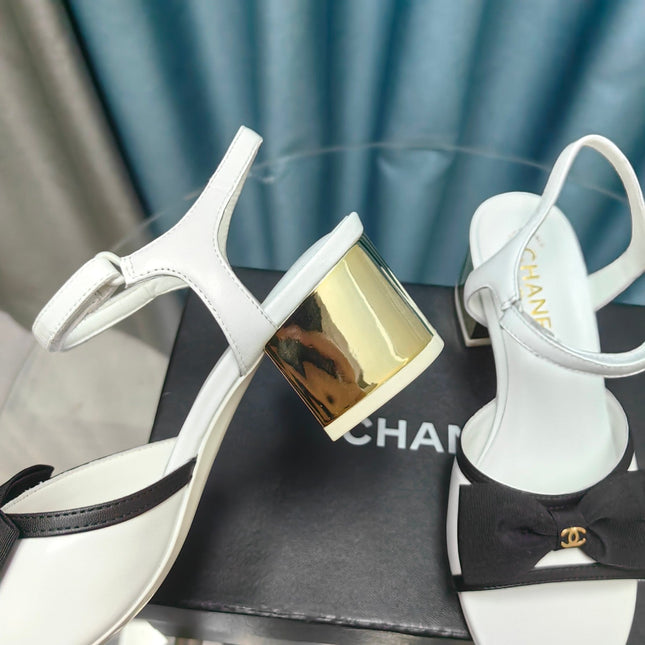 SANDALS IN WHITE SHEEPSKIN WITH BLACK SATIN BOW