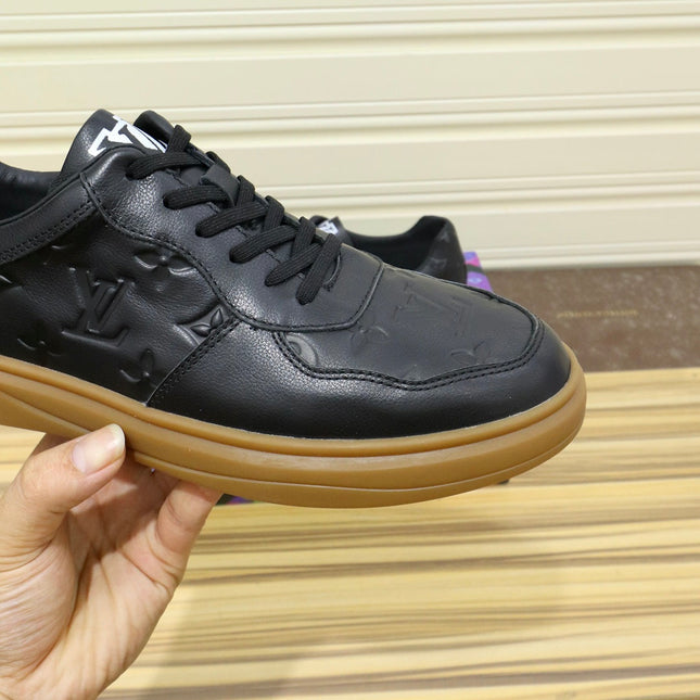 LV TRAINERS IN BLACK CALFSKIN AND BROWN RUBBER