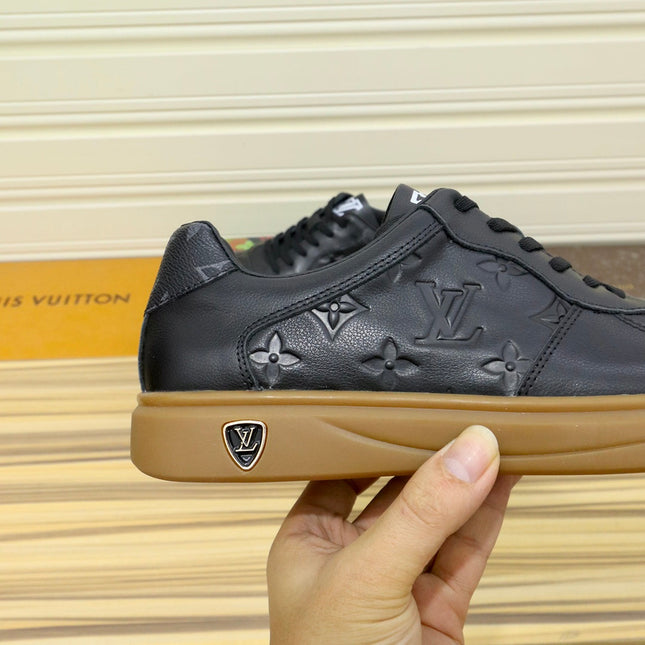 LV TRAINERS IN BLACK CALFSKIN AND BROWN RUBBER