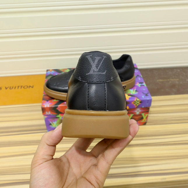LV TRAINERS IN BLACK CALFSKIN AND BROWN RUBBER