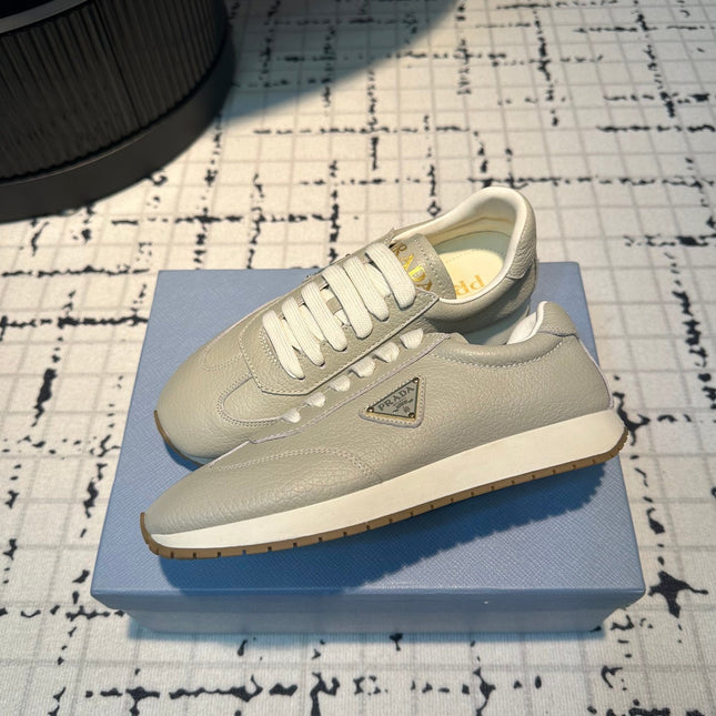 PRA TRIANGLE LOGO SNEAKERS LIGHT GRAY CALFSKIN