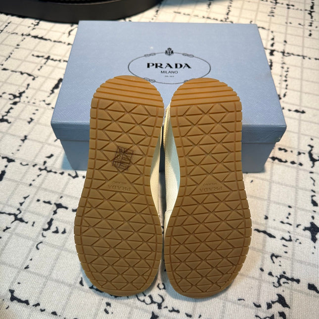 PRA TRIANGLE LOGO SNEAKERS WHITE CALFSKIN