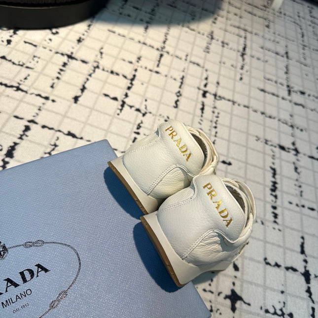 PRA TRIANGLE LOGO SNEAKERS WHITE CALFSKIN