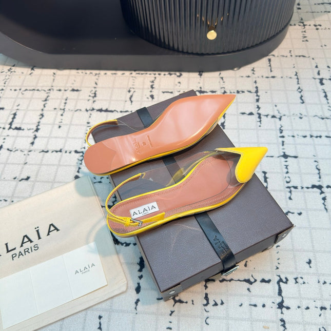 ALAIA FLAT SLINGBACK IN YELLOW PATENT CALFSKIN AND FILM