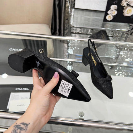 CHANEL 25S SANDALS WITH A BOW 60MM IN SPARKLING BLACK CANVAS