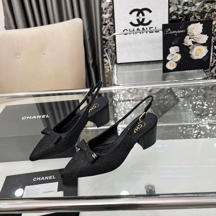 CHANEL 25S SANDALS WITH A BOW 60MM IN SPARKLING BLACK CANVAS