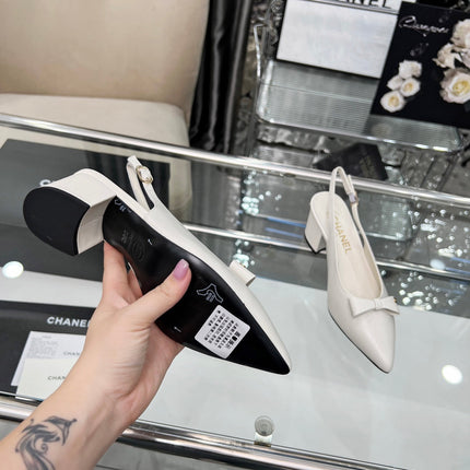 CHANEL 25S SANDALS WITH A BOW 60MM IN WHITE CALFSKIN