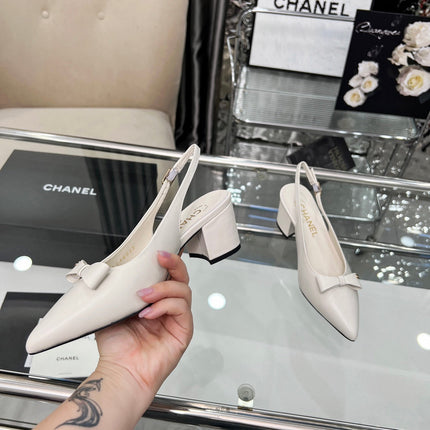 CHANEL 25S SANDALS WITH A BOW 60MM IN WHITE CALFSKIN