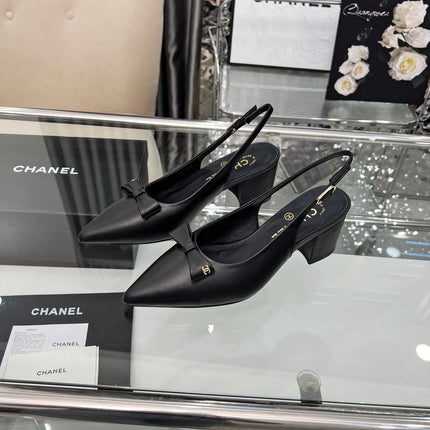 CHANEL 25S SANDALS WITH A BOW 60MM IN BLACK CALFSKIN