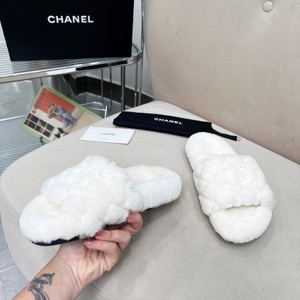 CHANEL 25S FUR SLIPPERS WITH EXPOSED-STITCH STRAPS IN WHITE
