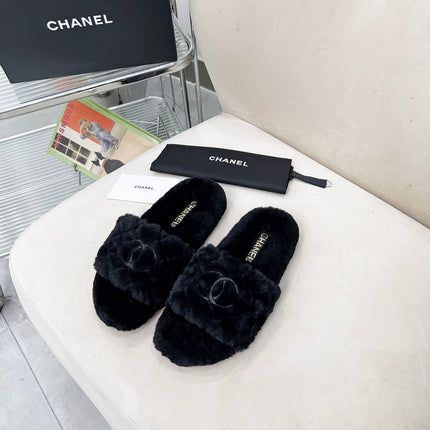 CHANEL 25S FUR SLIPPERS WITH EXPOSED-STITCH STRAPS IN BLACK