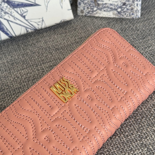 VERTICAL LONG ZIP WALLET 20 IN BABY PINK QUILTED ALLOVER CALFSKIN