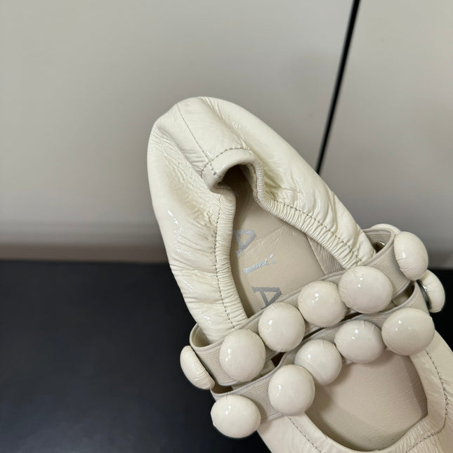ALAIA SPHERE BALLET FLATS IN WHITE LAMBSKIN