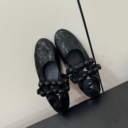 ALAIA SPHERE BALLET FLATS IN BLACK LAMBSKIN