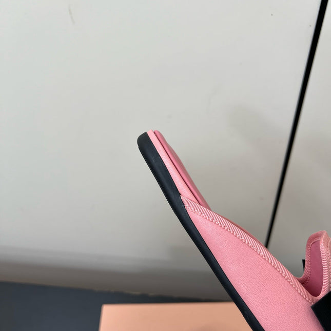 BOW MULES IN PINK SHEEPSKIN