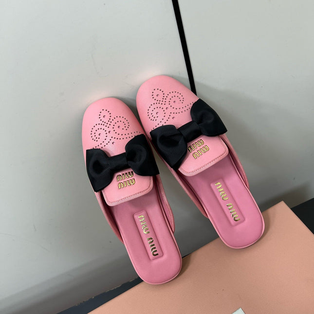 BOW MULES IN PINK SHEEPSKIN