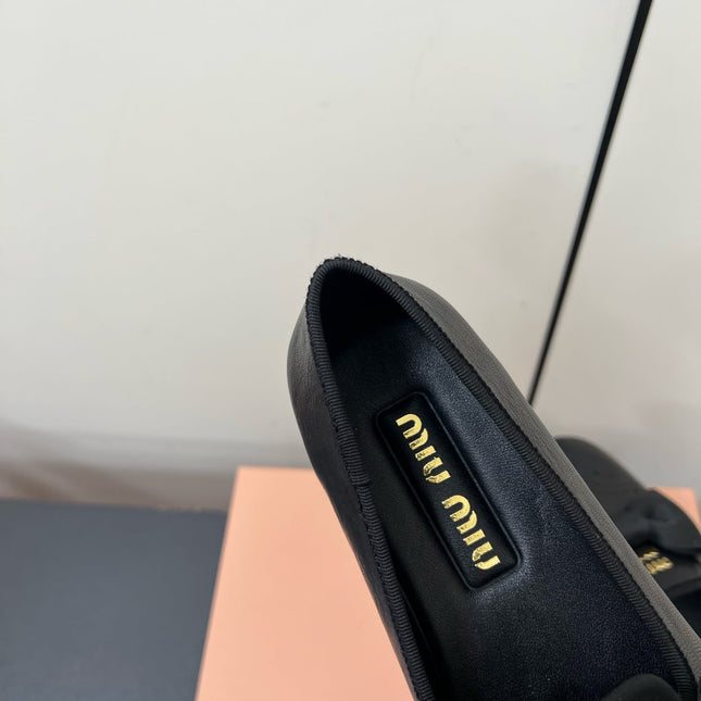 LOAFERS WITH BOW IN BLACK SHEEPSKIN