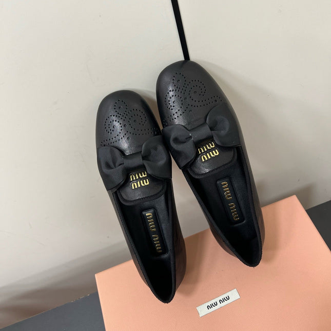 LOAFERS WITH BOW IN BLACK SHEEPSKIN