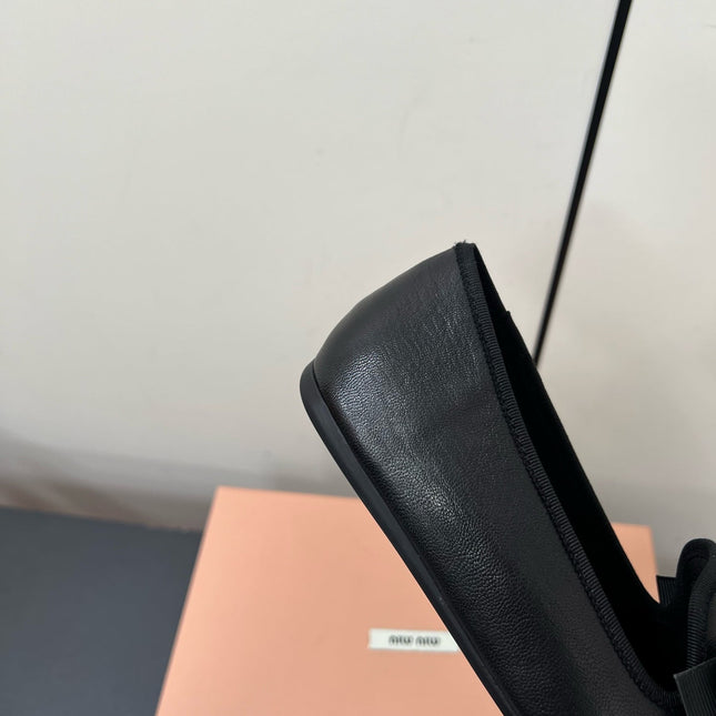 LOAFERS WITH BOW IN BLACK SHEEPSKIN