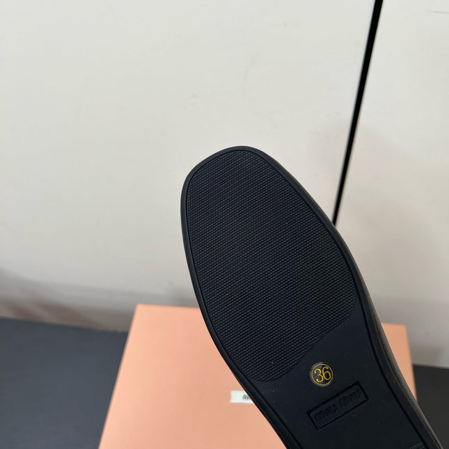 LOAFERS WITH BOW IN BLACK SHEEPSKIN