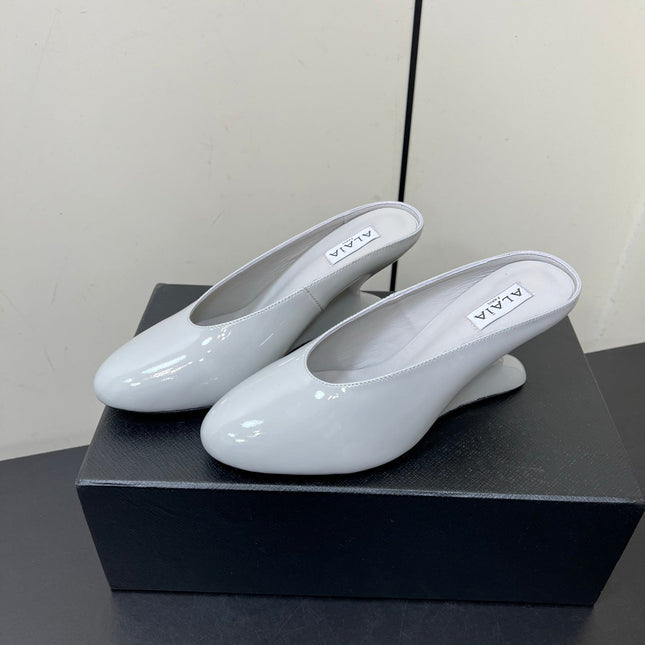 ALAIA WEDGE MULES 25S IN WHITE LAMBSKIN