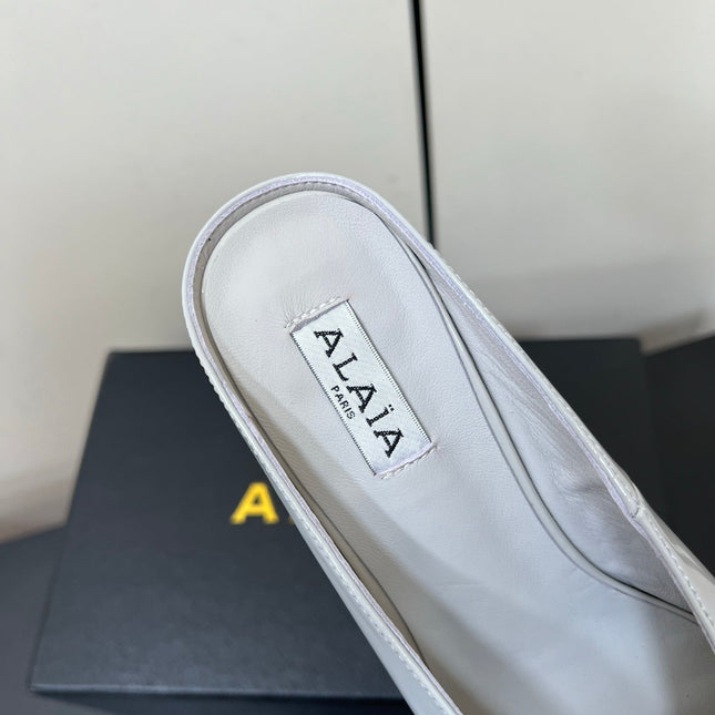 ALAIA WEDGE MULES 25S IN WHITE LAMBSKIN