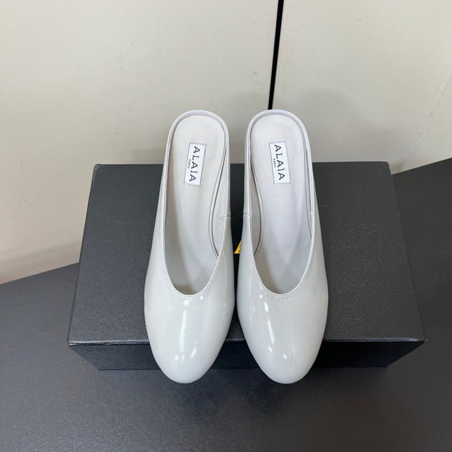 ALAIA WEDGE MULES 25S IN WHITE LAMBSKIN