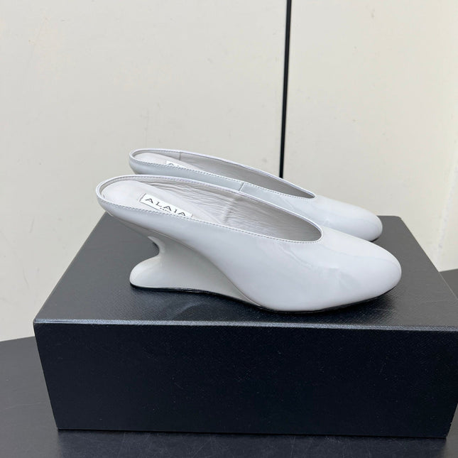 ALAIA WEDGE MULES 25S IN WHITE LAMBSKIN