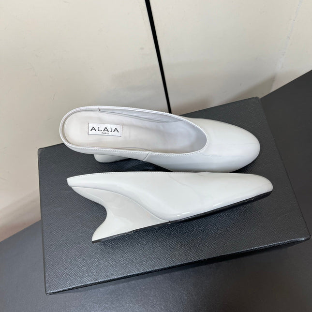 ALAIA WEDGE MULES 25S IN WHITE LAMBSKIN