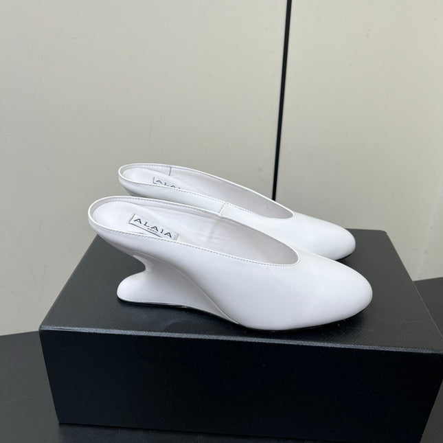 ALAIA WEDGE MULES 25S IN CREAM WHITE LAMBSKIN