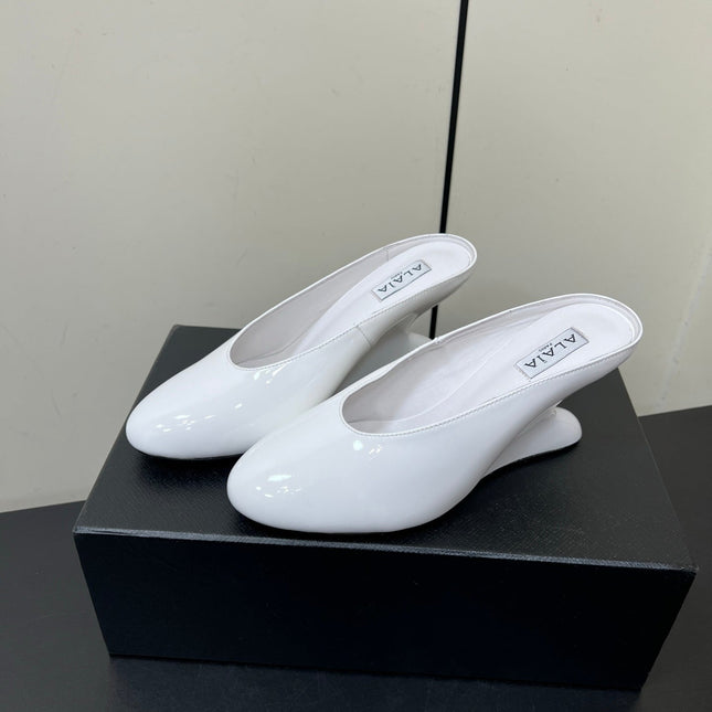 ALAIA WEDGE MULES 25S IN CREAM WHITE LAMBSKIN