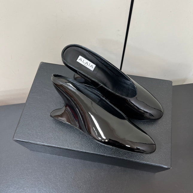ALAIA WEDGE MULES 25S IN BLACK LAMBSKIN