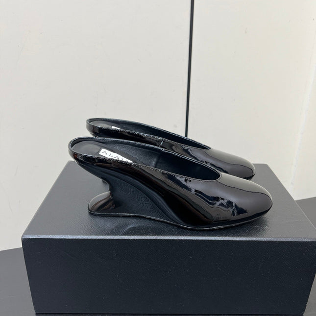 ALAIA WEDGE MULES 25S IN BLACK LAMBSKIN