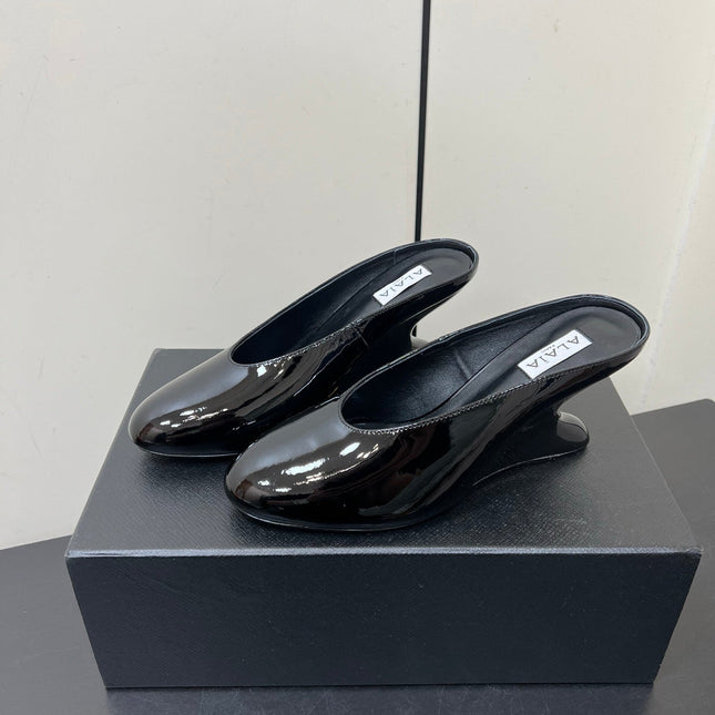 ALAIA WEDGE MULES 25S IN BLACK LAMBSKIN