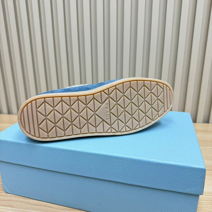 LOAFER IN AZURE BLUE SUEDE AND FUR LINING ATTACHED TRIANGLE LOGO