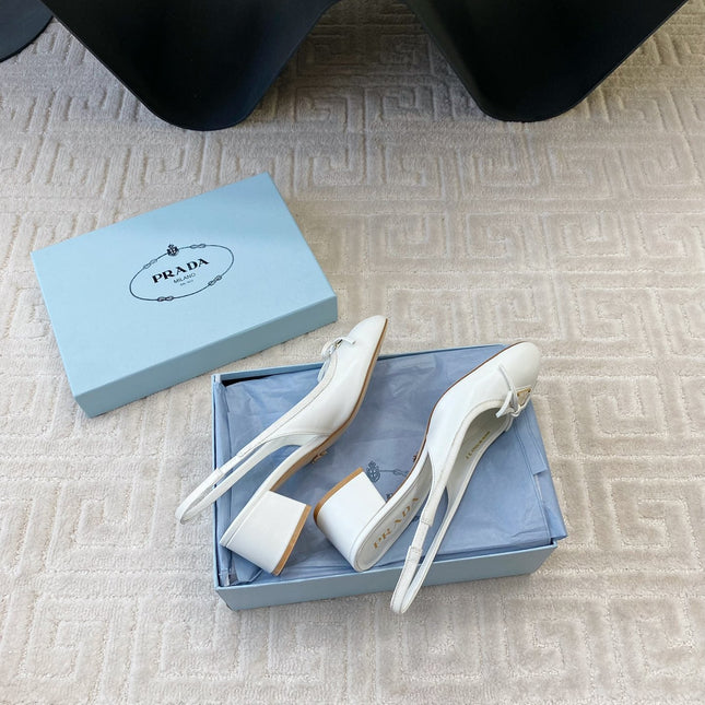 TRIANGLE LOGO SLINGBACK PUMPS WITH BOW IN WHITE CALFSKIN