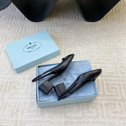 TRIANGLE LOGO SLINGBACK PUMPS WITH BOW IN BLACK CALFSKIN