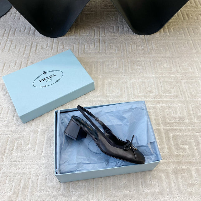 TRIANGLE LOGO SLINGBACK PUMPS WITH BOW IN BLACK CALFSKIN