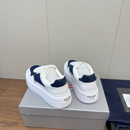 PRADA 25S DOWNTOWN BOLD SNEAKERS 45MM IN WHITE AND NAVY BLUE CALFSKIN