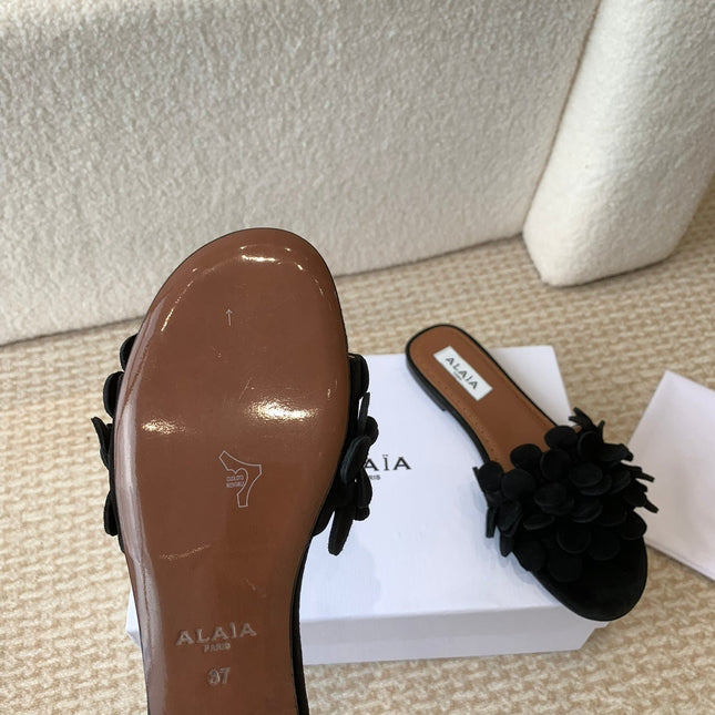 ALAIA FLAT MULE IN BLACK SUEDE