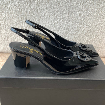 MID-HEEL SLINGBACKS IN BLACK PATENT CALFSKIN