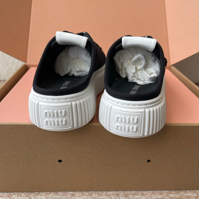 WASH SNEAKER MULES IN BLACK DENIM