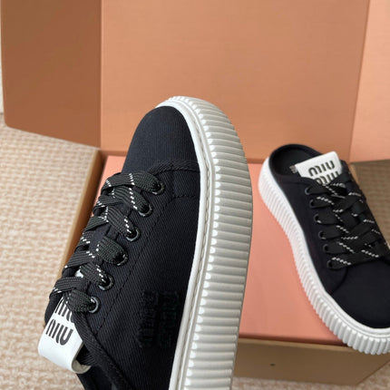 WASH SNEAKER MULES IN BLACK DENIM