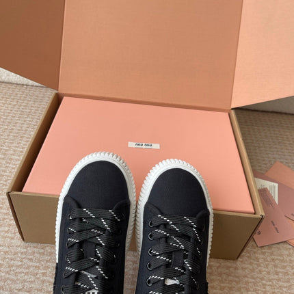 WASH SNEAKER MULES IN BLACK DENIM